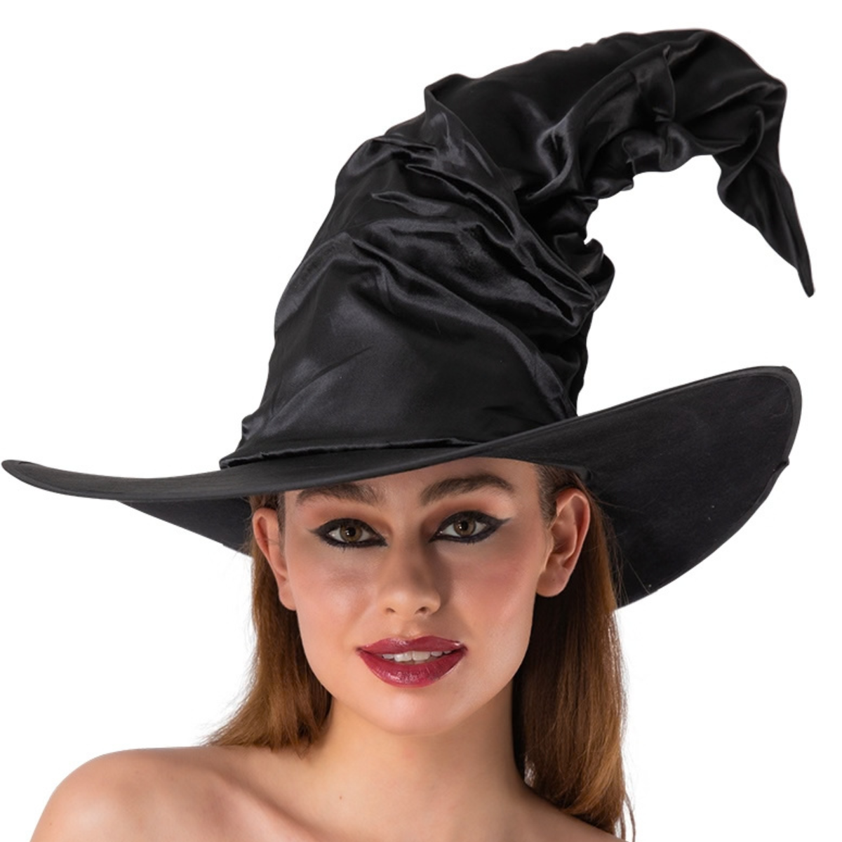 A woman wearing a black satin witch hat with a wide brim, shown against a plain white background.