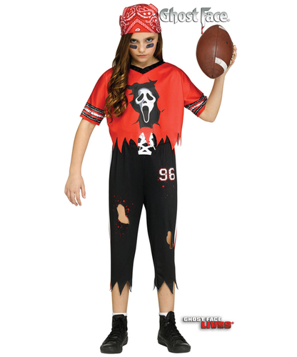 A child modeling a Ghostface Halloween costume from Shoes Live, featuring a red and black tattered jersey with a Ghostface face graphic, ripped black pants, a red bandana, and a football, on a white background.