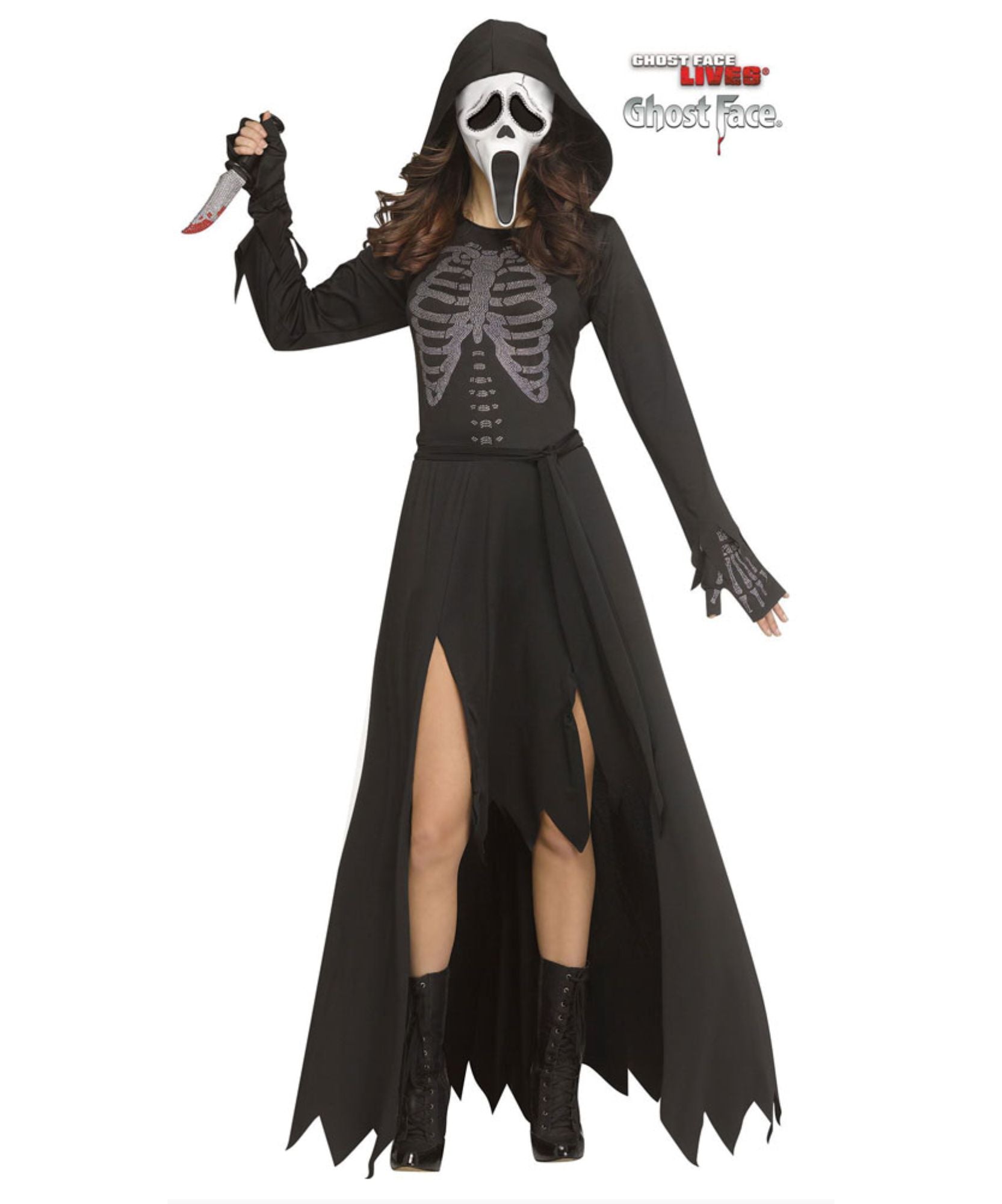 A woman modeling a black Scream-inspired hooded costume dress with a gray skeleton print on the chest, a white mask with black details, black gloves, and black lace-up boots. She holds a knife prop against a plain white background.